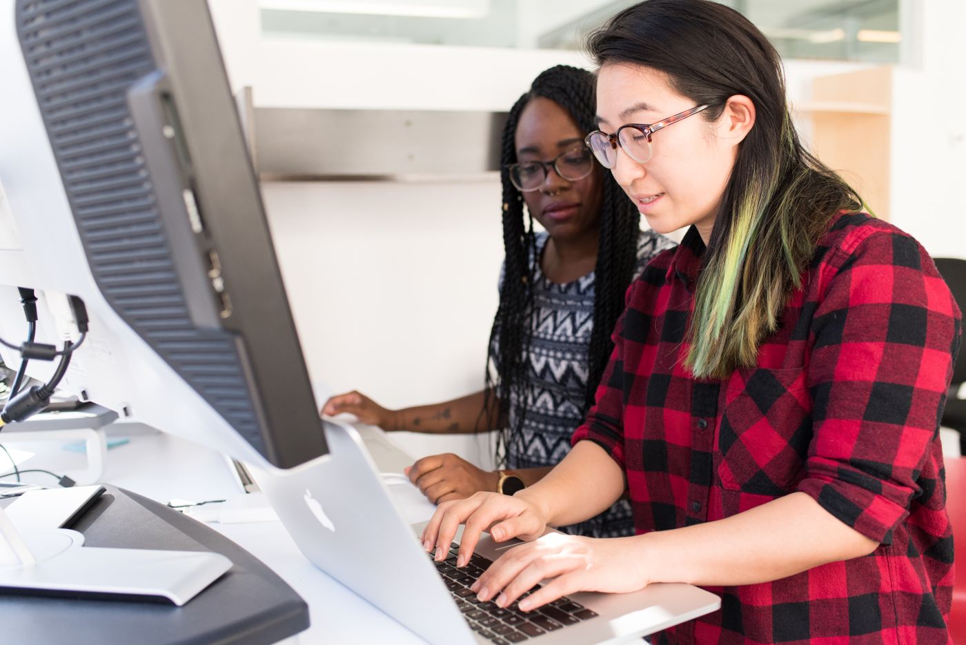 Two developers working together at one computer